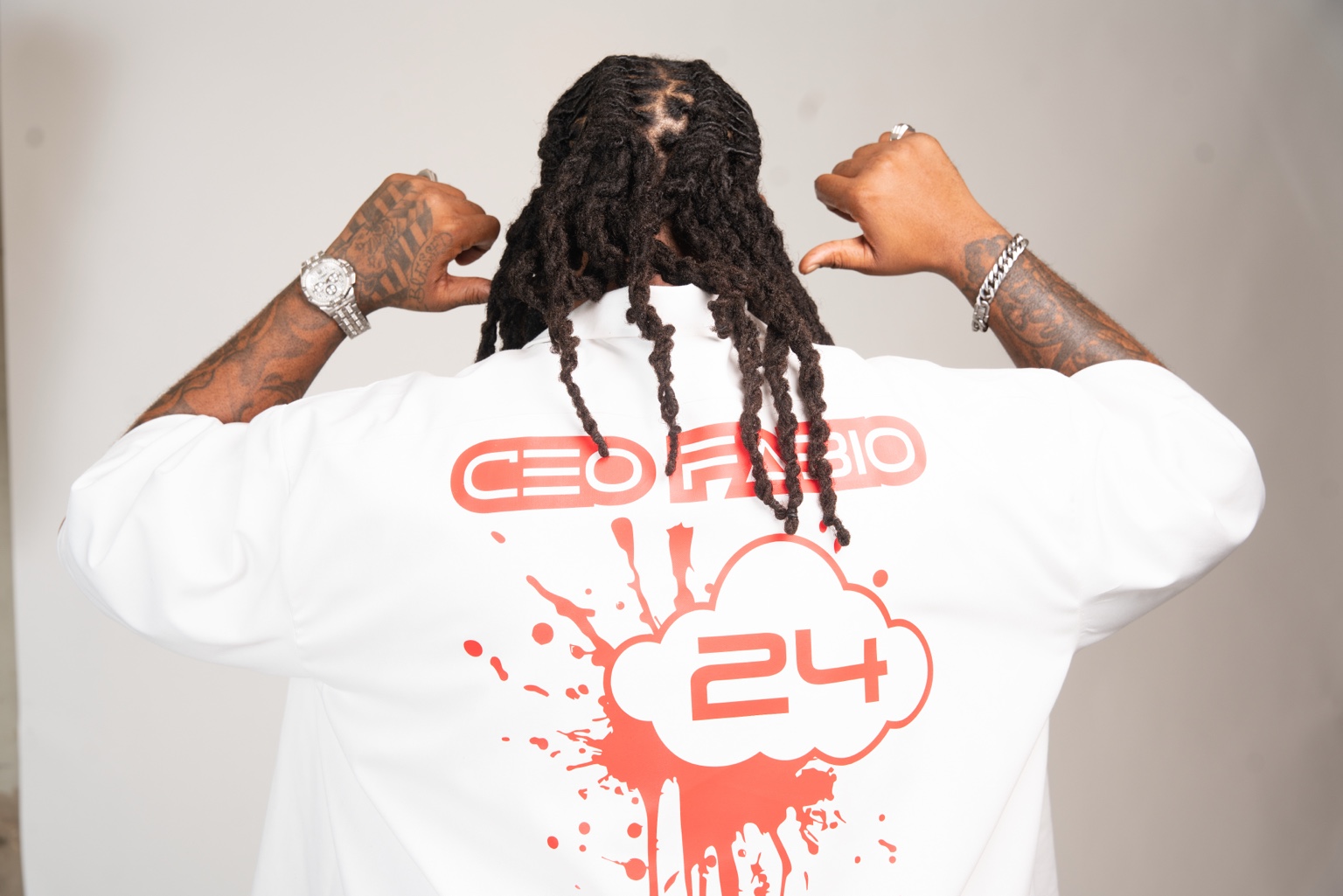 CEO Fabio showing the red CEO Fabio branding on his white shirt